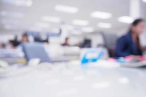 office blurred background with people working at desk photo