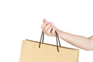 Female hand holding shopping bag photo