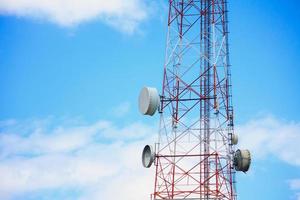 Telecommunication tower and satellite on blue sky photo