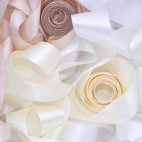 white and beige ribbon in sewing shop photo