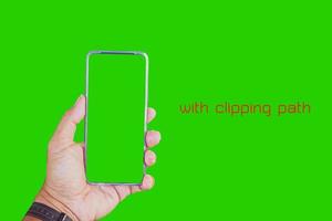 Close-up of male hand holding smartphone with mockup. .Man holding phone on white background with copy space. Man holding smartphone with white screen. Hands with blank cell phone display, Close-up.