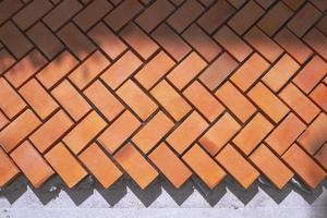 Sunlight and shadow on zig zag pattern of pedestrian pavement in under construction, top view with copy space photo