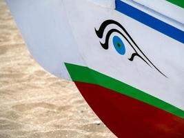 CALA DE MIJAS, SPAIN, 2014. Eye Symbol on a Spanish Fishing Boat at La Cala de Mijas photo