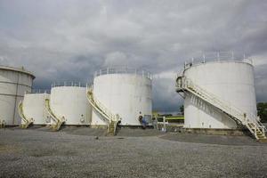 The row of small white tanks for petrol station and refinery photo