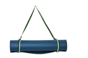 Close up view of green yoga mat for exercise, isolated white photo