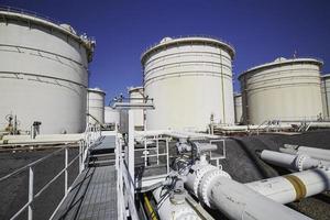 Row of large white tanks for petrol pipeline oil photo