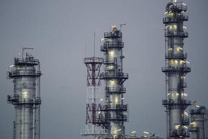 Scene evening of tank oil refinery plant tower and column distillery smok photo