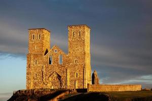 RECULVER, ENGLAND, UK, 2008. Remains of Reculver Church Towers Bathed in Late Afternoon Sun in Winter at Reculver in Kent on December 10, 2008 photo