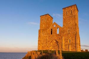 RECULVER, ENGLAND, UK, 2008. Remains of Reculver Church Towers Bathed in Late Afternoon Sun in Winter at Reculver in Kent on December 10, 2008 photo