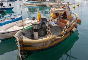 LERICI, LIGURI, ITALY, 2019. Boats in the harbour in Lerici in Liguria Italy on April 21, 2019. Two unidentified people photo
