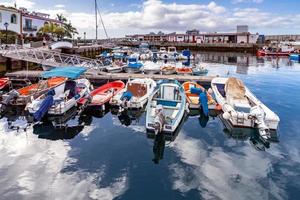 PUERTO DE MOGAN, GRAN CANARIA, CANARY ISLANDS, 2022.  View of the marina in Puerto de Mogan Gran Canaria on March 7, 2022. Four unidentified people photo