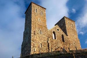 RECULVER, ENGLAND, UK, 2008. Remains of Reculver Church Towers Bathed in Late Afternoon Sun in Winter at Reculver in Kent on December 10, 2008 photo