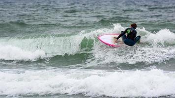 BUDE, CORNWALL, UK, 2013. Surfing at Bude in Cornwall on August 13, 2013. Unidentified person photo
