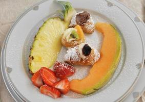 A dish of traditional organic vegetarian fruits photo