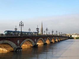 Bordeaux, France, 2016. Tram Passing over the Pont de Pierre Spanning the River Garonne in Bordeaux photo