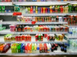 Blurred of product shelves in supermarket photo