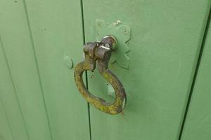 Iron Handles on Green Doors photo