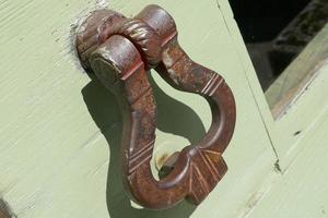 Iron Handles on Green Doors photo