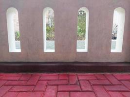 red paving floor pattern and white walls photo