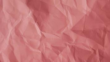 Pink crumpled paper texture for background with copy space for image or text photo
