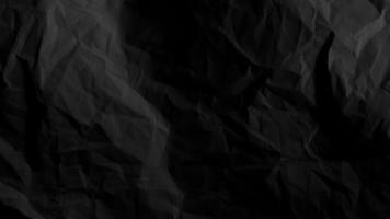 Black crumpled paper background with copy space for image or text photo