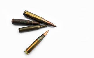 isolated old ak and m16 bullets on white background, soft and selective focus. photo