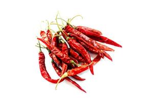 Dry red chillies on a white background photo