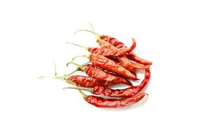 Dry red chillies on a white background photo