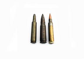 isolated old ak and m16 bullets on white background, soft and selective focus. photo