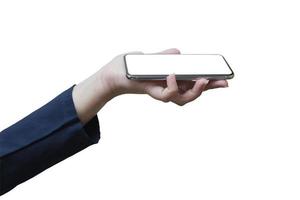 The left hand of a white woman showing a black mobile phone or cellphone and a white screen for mockup content at an isolated or cutout white background with clipping path.