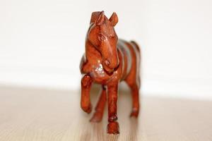The wooden horse. It is a carving horse.