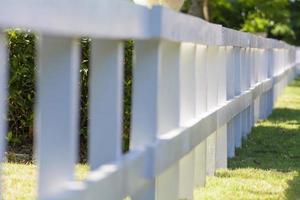 A fence is a freestanding structure designed to restrict or prevent movement across a boundary.