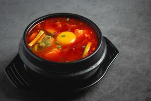 tofu and yolk boiled in spicy soup photo