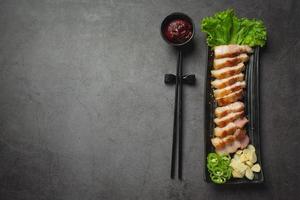 grilled pork served with sauce in korean style photo