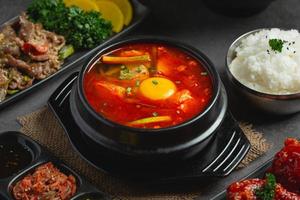 tofu and yolk boiled in spicy soup photo