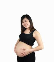 Pregnant woman holding on her belly isolated on white background. Family mother mom pregnant concept. photo