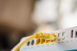 internet modem router hub with a ethernet cable connecting photo