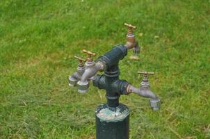 Water taps fountain in a camping area for caravans photo