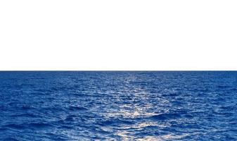 Blue sea waves over white background horizon photo