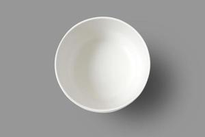 Empty bowl isolated on gray background with clipping path. Top view. photo