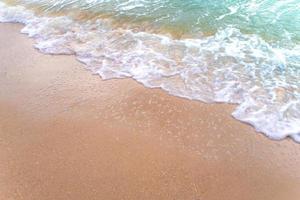 Bubble of Sea wave on sand photo