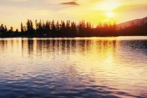 Sunset over the lake. Majestic mountain  in National Park Hi photo