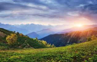 Autumn landscape and snowy mountain peaks. photo