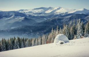 yurt in winter fog mountains. Carpathian, Ukraine, Europe photo