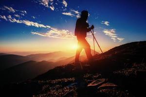 hiker at sunset. Beauty world photo