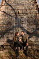 Lovely couple spending autumn day outdoors with their dog photo