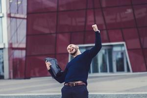 Portrait of smiling man with the fists up photo