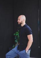 bald man with a beard in a t-shirt photo