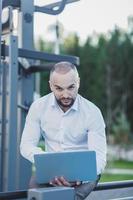 man using a portable computer photo