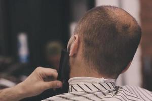 man visiting barbershop photo